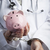 Doctor In Handcuffs Holding Piggy Bank Wearing Lab Coat, Stethos stock photo © feverpitch