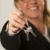 Woman Presenting Keys stock photo © feverpitch