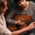 Young Musician Teaches Female Student To Play the Guitar stock photo © feverpitch
