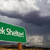 Seek Shelter Green Road Sign and Stormy Clouds stock photo © feverpitch