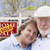 Senior Couple in Front of Sold Real Estate Sign and House stock photo © feverpitch