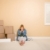 Upset Woman on Floor Next to Boxes and Blank Sign stock photo © feverpitch