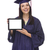 Female Graduate in Cap and Gown Holding Blank Computer Tablet stock photo © feverpitch