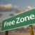 Free Zone Green Road Sign and Clouds stock photo © feverpitch