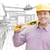 Contractor in Hard Hat with Level Over Custom Kitchen Drawing stock photo © feverpitch