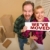 Goofy Couple Holding We've Moved Sign Surrounded by Boxes stock photo © feverpitch