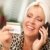 Smiling Robed Woman on Cell Phone With Credit Card stock photo © feverpitch