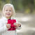 kislány · tart · piros · karácsony · ajándék · kint - stock fotó © feverpitch