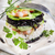 Tower of black and white rice with shrimp and zucchini stock photo © Fotografiche
