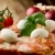 pizza · mozzarella · fetta · tavolo · in · legno · pomodoro - foto d'archivio © Francesco83