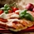 pizza · pomodorini · mozzarella · fetta · tavolo · in · legno - foto d'archivio © Francesco83