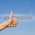 hand with thumbs up for success or winning stock photo © godfer
