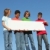 group of diverse kids holding white sign stock photo © godfer