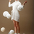 Falling Skeins. Surprised Woman in Woolen Knitted Jersey with White Balls of Yarn stock photo © gromovataya