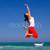 mulher · jovem · saltando · belo · praia · céu · primavera - foto stock © iko