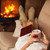 Woman relaxing by the fire holding a cup of hot chocolate with c stock photo © ilona75