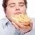 chubby man with French fries stock photo © imarin