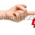 Hand holding key with a keychain in the shape of the house on th stock photo © inxti