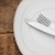 White empty plate with fork and knife on wood table stock photo © inxti