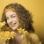 Woman smiling with flowers. stock photo © iofoto