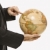 Businessman holding globe. stock photo © iofoto