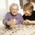 Elderly Woman and Younger Woman Doing Puzzle stock photo © iofoto