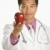 Doctor holding apple. stock photo © iofoto