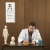 Doctor writing at desk. stock photo © iofoto