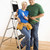 Man and woman with tools and ladder. stock photo © iofoto