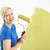 Woman painting wall. stock photo © iofoto