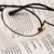 A pair of glasses on a book concepts of knowledge and education stock photo © johnkwan