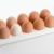 the hen's eggs in egg holder stock photo © karandaev