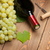 Red wine bottle and bunch of white grapes stock photo © karandaev