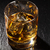 Glass of scotch whiskey with ice stock photo © karandaev
