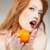 Young woman holding an orange stock photo © konradbak