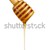 honey flowing down from a wooden stick stock photo © konturvid