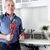Plumber in kitchen with a wrench. stock photo © Kurhan