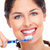 mooie · vrouw · glimlach · tandenborstel · geïsoleerd · witte · vrouw - stockfoto © Kurhan