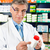 Pharmacist in pharmacy with medicament stock photo © Kzenon