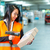 werknemer · pakket · magazijn · logistiek · vrouwelijke · vest - stockfoto © Kzenon