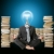 businessman in lotus pose and lamp-head with many books near stock photo © leedsn