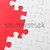 White jigsaw over red background stock photo © leungchopan