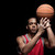 Young athletic man in uniform playing basketball with ball on black   stock photo © LightFieldStudios
