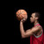 Side view of young man basketball player with ball on black stock photo © LightFieldStudios