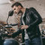biker in leather jacket with motorcycle stock photo © LightFieldStudios