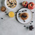 top view of sweet gourmet breakfast with pancakes, fruits, honey and muesli on grey    stock photo © LightFieldStudios