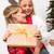 mother and daughter with christmas present stock photo © LightFieldStudios