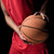 Close-up partial view of young sporty man holding basketball ball stock photo © LightFieldStudios