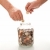 Senior hands collecting coins in a glass jar stock photo © lightkeeper