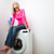 Housework: young woman doing laundry stock photo © lightpoet